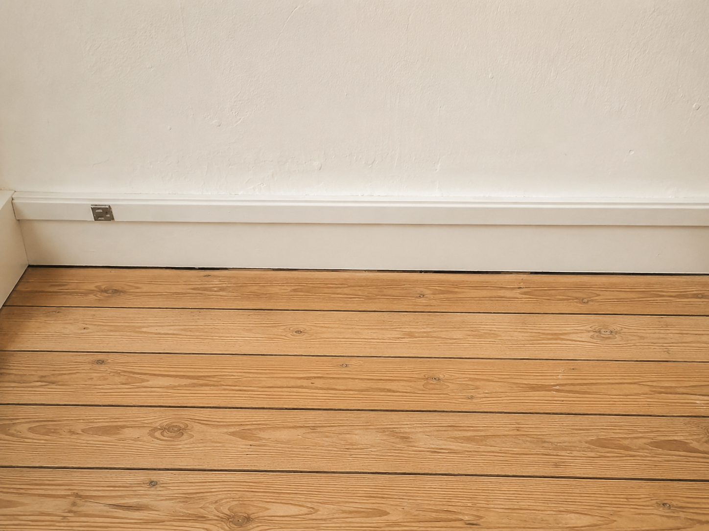 Finished basement with new flooring and lighting