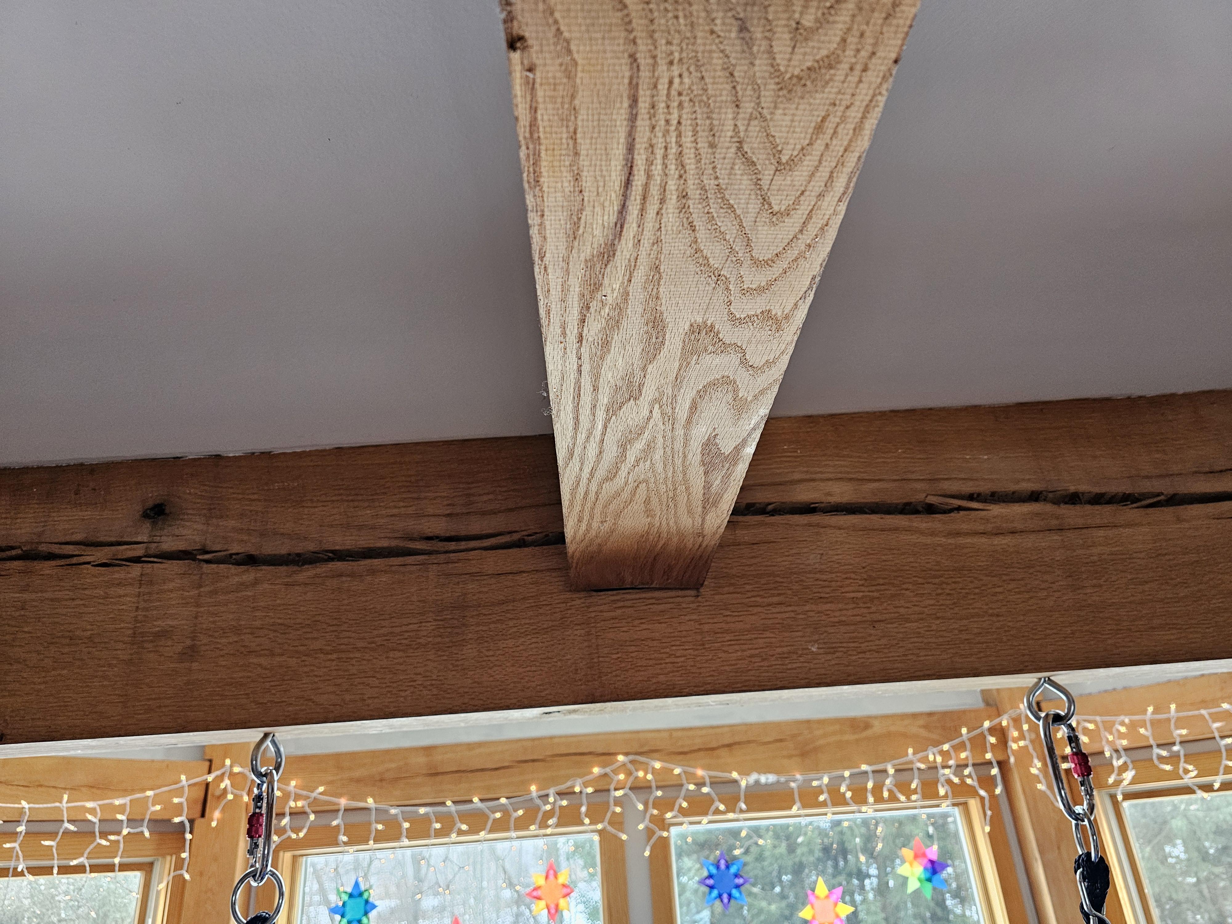 Steel lally support column in a basement