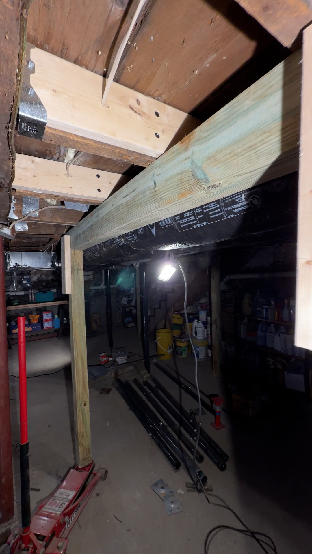 New beam and steel columns in a Boston basement