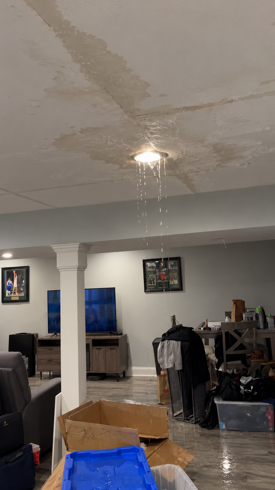 Drying fans running in a water damaged room